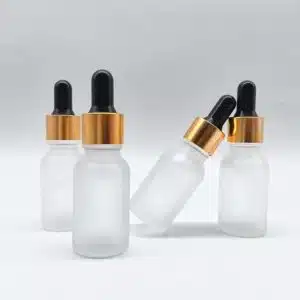 Flacon compte goutte en verre transparent givré bouchon doré-noir (1)