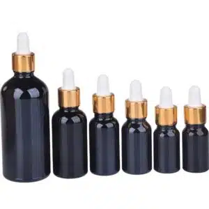 Flacon compte goutte verre noir bouchon doré-blanc (1)