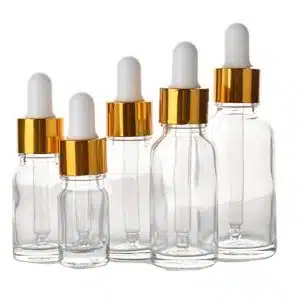 Flacon compte goutte verre transparent bouchon doré-blanc (2)