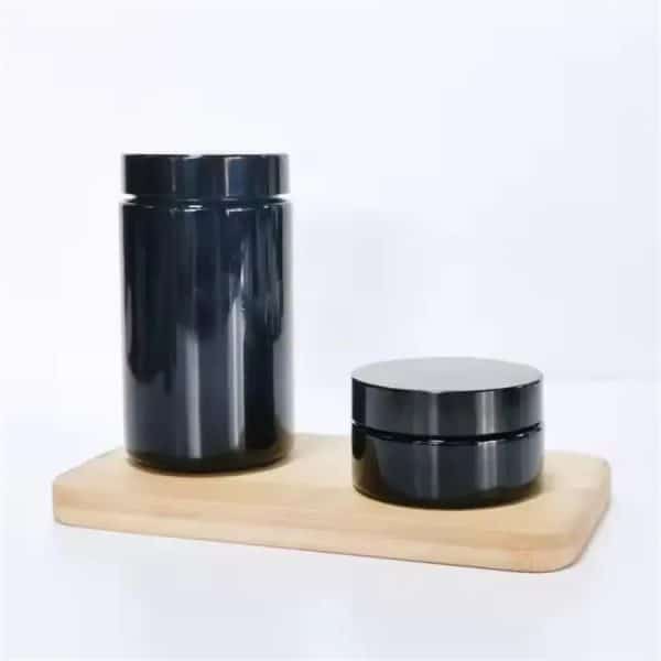 Emballages ronds noirs avec couvercle twist-off Design moderne pour une conservation optimale