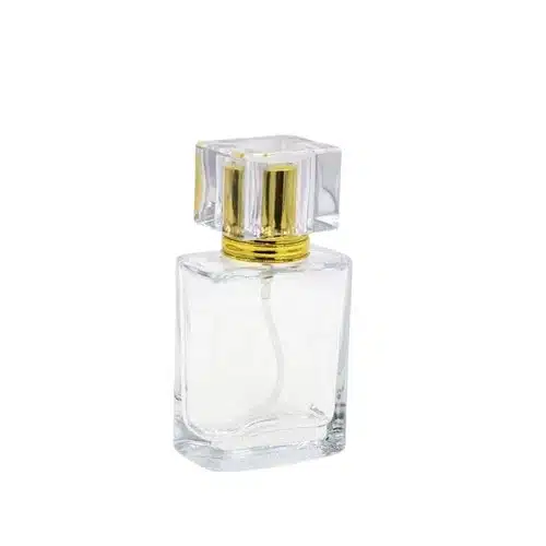 Flacon de parfum carré en verre transparent avec pulvérisateur doré et capuchon acrylique emballage maroc parfum